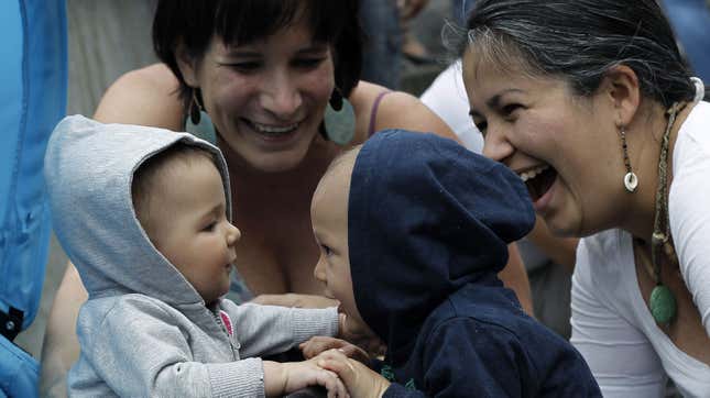 Two women join their children during a demonstration to demand longer maternity leave in San Jose January 18, 2013. Women's rights groups marched to demand the approval of an extension of maternity leave from 4 to 7 months, said event organiser Cristivel Leandro. REUTERS/Juan Carlos Ulate