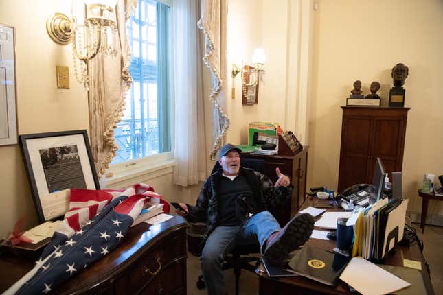 Image for article titled Man Photographed Sitting in Nancy Pelosi&#39;s Office Arrested and in FBI Custody; Now Let&#39;s Focus on How Dumb He Is