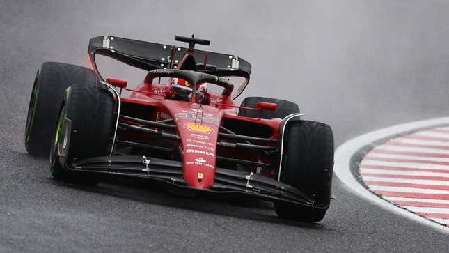 A photo of Charles Leclerc racing his red Ferrari F1 car in Japan. 
