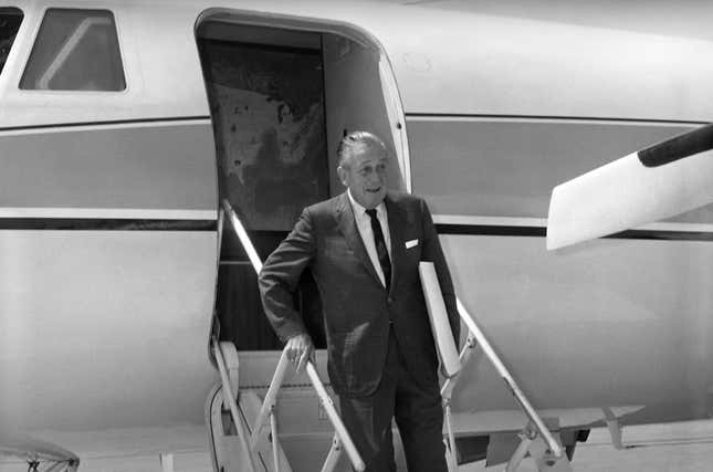 Walt Disney disembarking plane