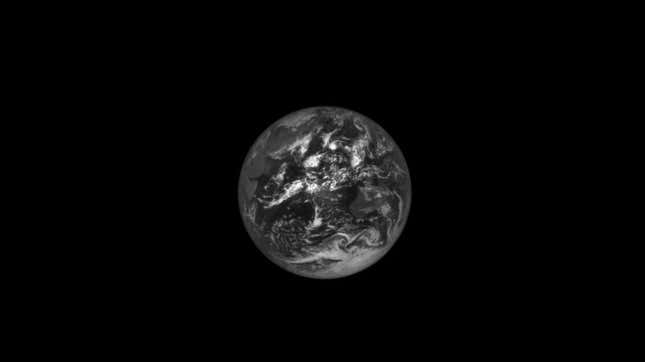 Image for article titled NASA's Asteroid Probe Captures Haunting Images of the Earth and Moon