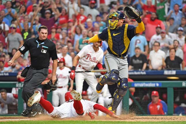 Jul 19, 2023; Philadelphia, Pennsylvania, USA; Philadelphia Phillies center fielder Brandon Marsh (16) slides safely into home as Milwaukee Brewers catcher William Contreras (24) moves out of the way during the fifth inning at Citizens Bank Park.