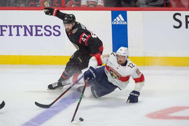 Mar 27, 2023; Ottawa, Ontario, CAN; Ottawa Senators center Mark Kastelic (47) battles with Florida Panthers center Eric Staal (12) in the third period at the Canadian Tire Centre.
