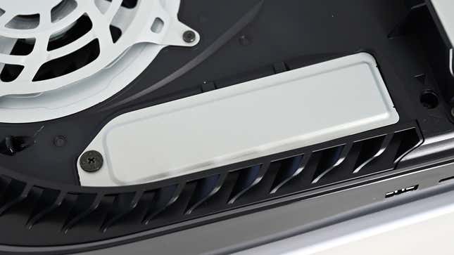 If you remove the PS5's right side panel, you'll see this plate covering up the PS5's M.2 SSD expansion slot.