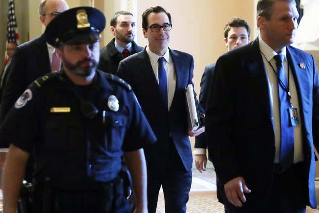 Secretary of the Treasury Steven Mnuchin walks in a hallway at the U.S. Capitol on March 23, 2020, in Washington, DC. Secretary Mnuchin is on Capitol Hill to work with the Senate to finalize the coronavirus stimulus bill in response to the outbreak of the COVID-19 pandemic.