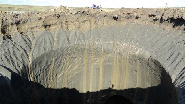 A photo taken on August 25, 2014 shows a crater on the Yamal Peninsula, northern Siberia.