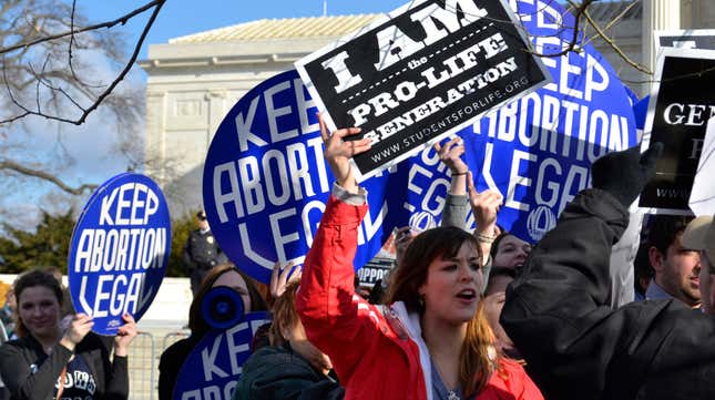A pro-life woman clashing with a group of pro-choice demonstrators at the U.S. Supreme Court in 2015