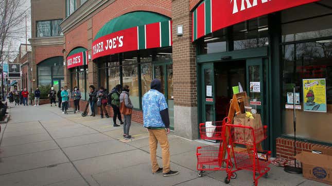 Shoppers waiting in line to get inside a Trader Joe’s in Brookline, Massachusetts