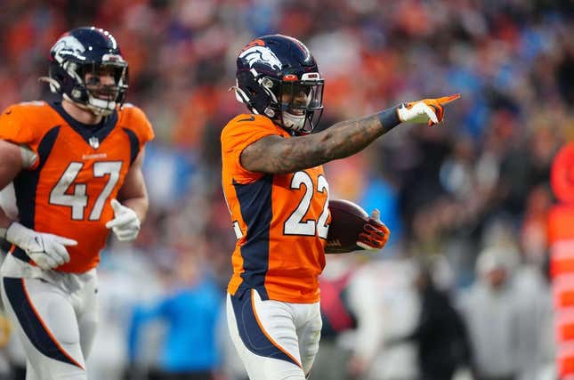 Jan 8, 2023; Denver, Colorado, USA; Denver Broncos safety Kareem Jackson (22) celebrates after recovering a fumble against the Denver Broncos in the fourth quarter at Empower Field at Mile High.