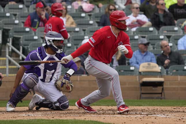 Mar 22, 2023; Salt River Pima-Maricopa, Arizona, USA; Los Angeles Angels first baseman Jared Walsh (20) hits an RBI double against the Colorado Rockies in the fourth inning at Salt River Fields at Talking Stick.
