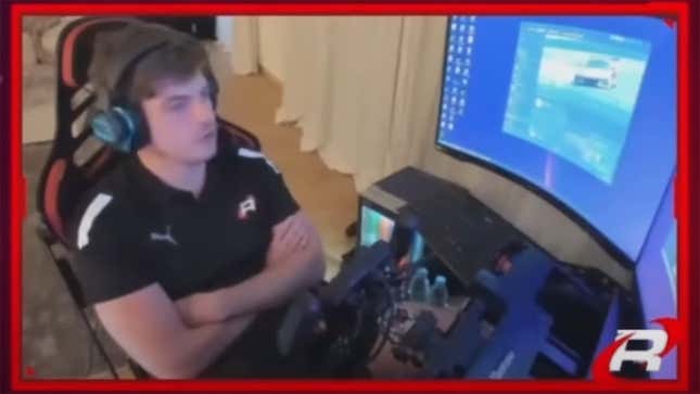 Max Verstappen sits at his sim racing rig and speaks during a live stream moments after his car retires from the 2023 24 Hours of Le Mans Virtual race in rFactor 2.