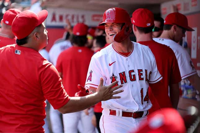 Oct 2, 2022; Anaheim, California, USA;  Los Angeles Angels catcher Logan O&#39;Hoppe (14) is greeted in the dugout after scoring a run during the first inning at Angel Stadium.