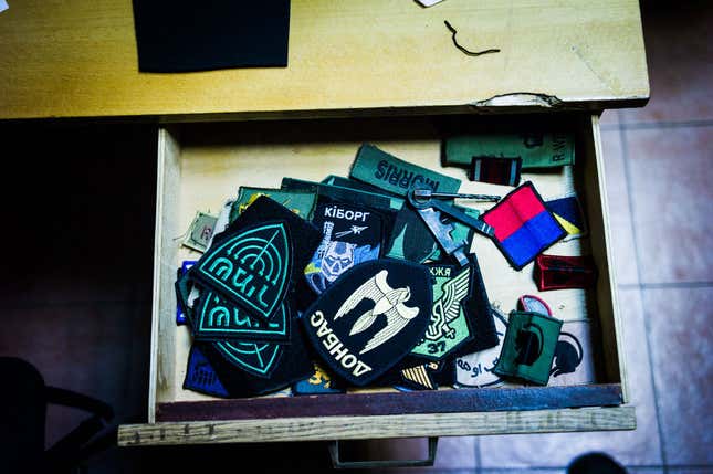 Krasnopolsky collects uniform patches of all sorts, both new and recycled from the military uniforms of various countries, all to be sent to the troops.