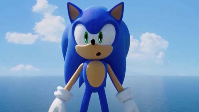 Sonic stands in front of a large ocean with his mouth open. 