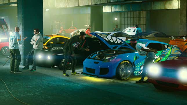 People hanging out in a warehouse filled with cool cars in GTA Online.