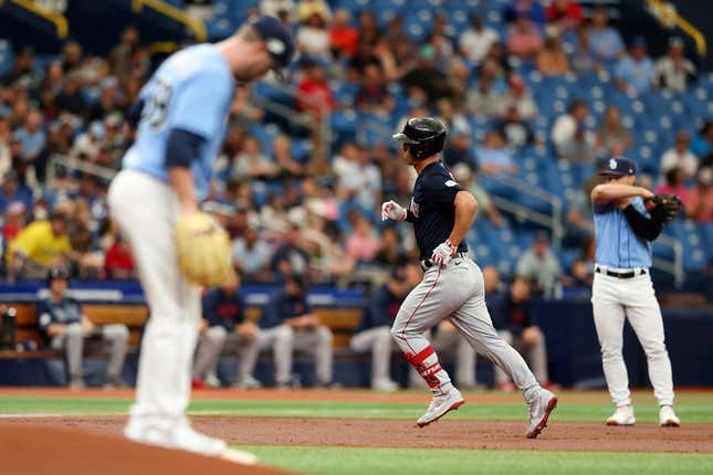 Apr 13, 2023; St. Petersburg, Florida, USA;  Boston Red Sox left fielder Rob Refsnyder (30) runs the bases after hitting a home run off of Tampa Bay Rays starting pitcher Jeffrey Springs (59) in the first inning at Tropicana Field.