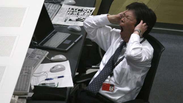 japan workforce declining birth rate birthrate productivity A stock dealer yawns during trading at the Tokyo Stock Exchange in Tokyo March 2, 2009. Japan's Nikkei stock average slid 3.2 percent on Monday, with Mitsubishi UFJ Financial Group and other banks sinking on fears about their U.S. peers, while exporters slipped on worry about the U.S. economy. REUTERS/Issei Kato