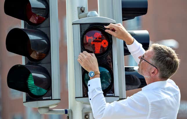 Director of Moesgaard Museum Mads Koehler Holst replaces the first of many pedestrian signals on Aug. 26.