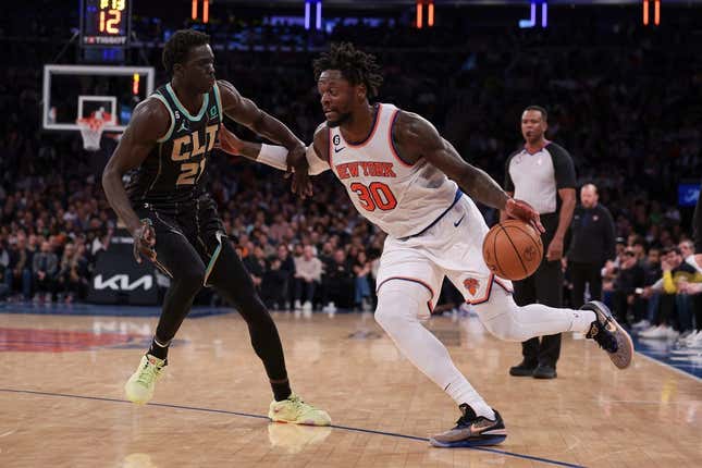 Mar 7, 2023; New York, New York, USA; New York Knicks forward Julius Randle (30) dribbles against Charlotte Hornets forward JT Thor (21) during the second half at Madison Square Garden.