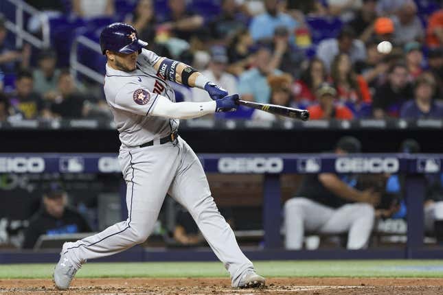 Aug 15, 2023; Miami, Florida, USA; Houston Astros catcher Yainer Diaz (21) hits a two-run home run against the Miami Marlins during the fourth inning at loanDepot Park.