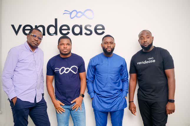 The Vendease founding team pose for a picture with the company logo in the background
