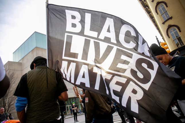 David Brown carries a Black Lives Matter flag during a march through downtown Grand Rapids, Mich., on Saturday, April 23, 2022. The march, which was organized by the Breonna Taylor Foundation,began at Veterans Park in response to the shooting death of Patrick Lyoya by a Grand Rapids police officer on April 4.