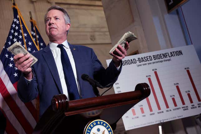 U.S. Sen. Roger Marshall (R-KS) holds stacks of money as he speaks during a press conference on inflation, at the Russell Senate Office Building on February 16, 2022, in Washington, DC.