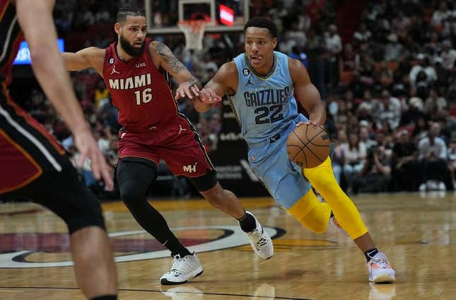 Mar 15, 2023; Miami, Florida, USA; Memphis Grizzlies guard Desmond Bane (22) drives to the basket as Miami Heat forward Caleb Martin (16) defends in the first half at Miami-Dade Arena.