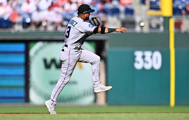 Apr 12, 2023; Philadelphia, Pennsylvania, USA; Miami Marlins second baseman Luis Arraez (3) throws to first against the Philadelphia Phillies in the second inning at Citizens Bank Park.