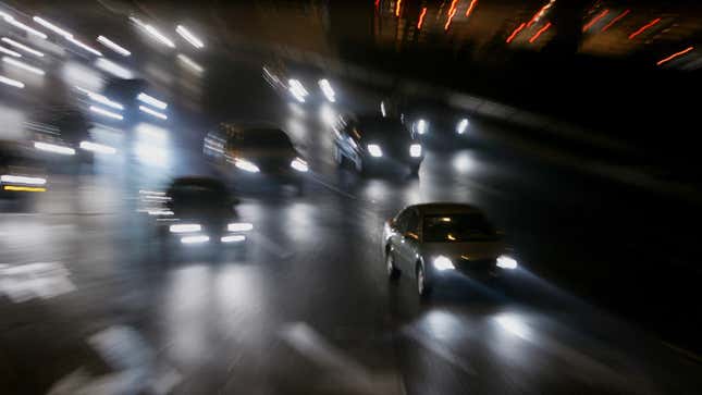 Vehicles driving on a highway at night