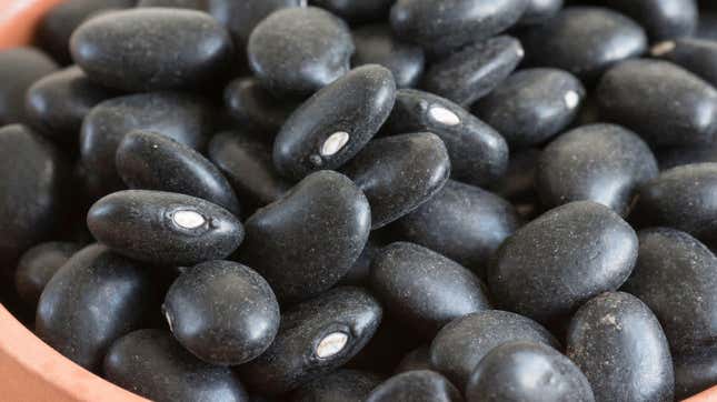 Pile of black beans in ceramic bowl