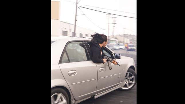 Image for article titled Woman Photographed Leaning Out Of A Cadillac Brandishing An AK-47, Car Impounded