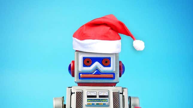 A toy robot in a Santa hat