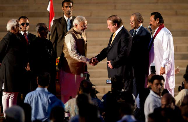 Narendra Modi with his Pakistani counterpart Nawaz Sharif, as then Sri Lankan president Mahinda Rajapaksa, right, and former Mauritius prime minister Navinchandra Ramgoolam, second right, look on during Modi’’s inauguration in New Delhi on May 26, 2014.