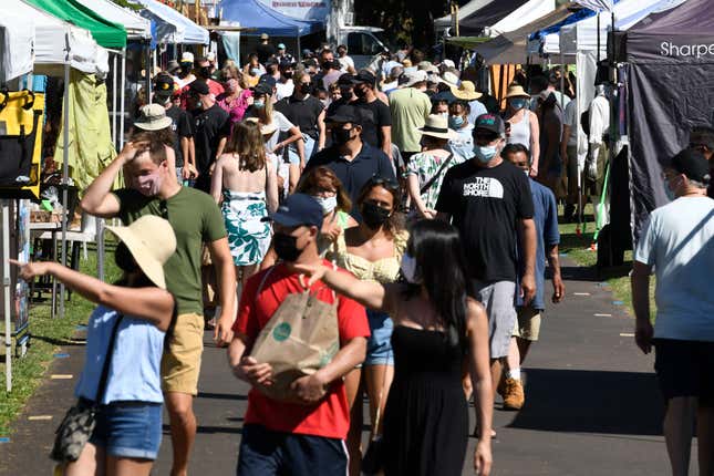 The Maui Swap Meet is jammed in its second week after reopening at the University of Hawaii Maui College in Kahului, Hawaii, Saturday, June 19, 2021. The Hawaiian island of Maui has become so overrun with tourists in recent months that its mayor is taking the unusual step of pleading with airlines to fly in fewer people.