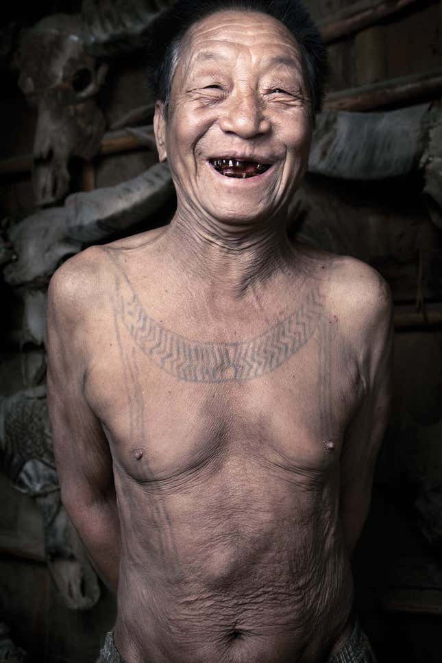 Hensungaubu, 80, shows off his traditional blackened teeth.
