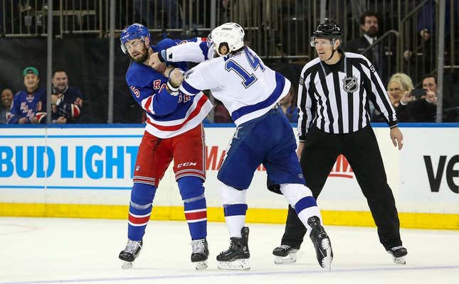 Apr 5, 2023; New York, New York, USA; New York Rangers defenseman Ben Harpur (5) fights Tampa Bay Lightning left wing Pat Maroon (14) during the first period at Madison Square Garden.