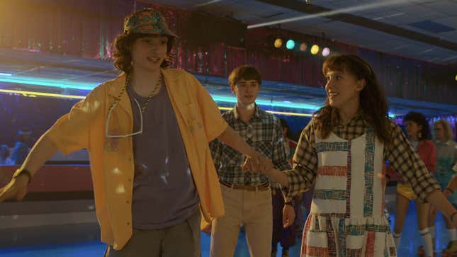 Will, Eleven and Mike roller skate