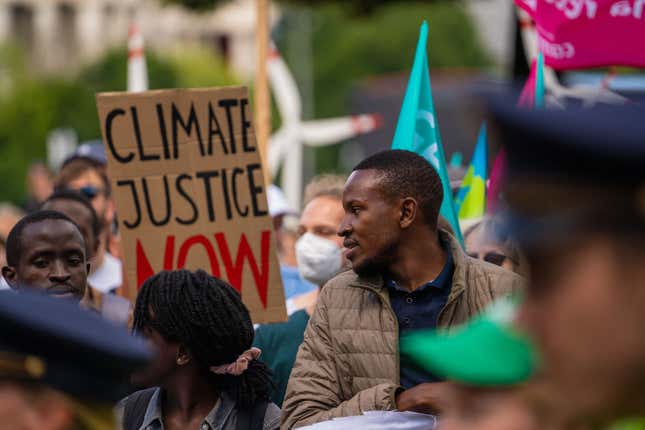 Black African man demands climate justice at demonstration G7 summit protest on Jun 25, 2022 in Munich, Germany. 