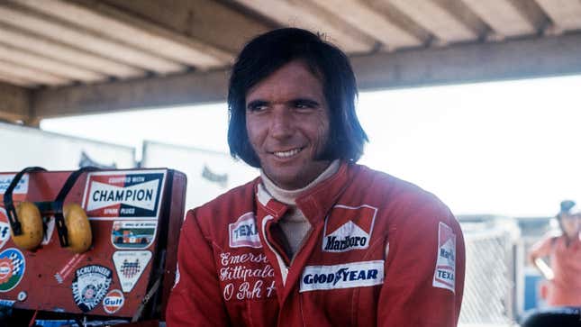 Emerson Fittipaldi smiles in the Formula 1 garage in the 1970s