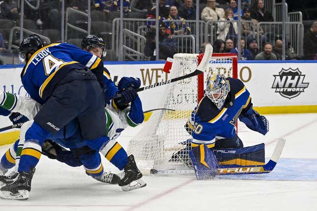 Mar 28, 2023; St. Louis, Missouri, USA; St. Louis Blues goaltender Jordan Binnington (50) defends the net against the Vancouver Canucks during the first period at Enterprise Center.