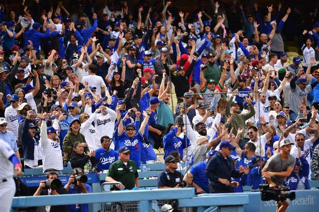 May 3, 2023; Los Angeles, California, USA; Fans cheer after Los Angeles Dodgers third baseman Max Muncy (13) hits a walk off grand slam home run against the Philadelphia Phillies during the ninth inning at Dodger Stadium.