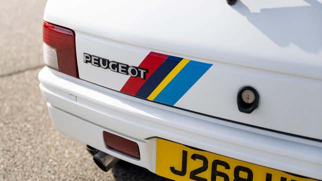 Photo of the old Peugeot badge on a 106 Rallye sold on Bring a Trailer