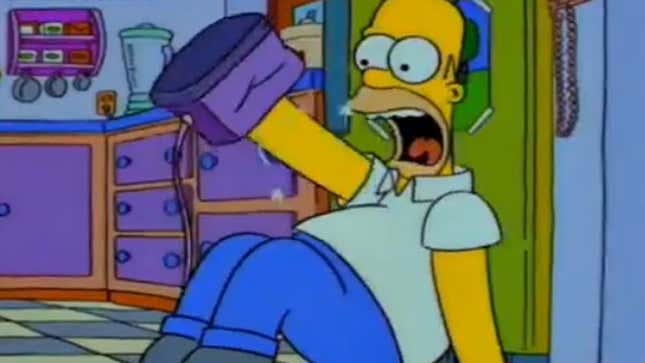 A screenshot from The Simpsons shows Homer pinch his manus successful a toaster. 