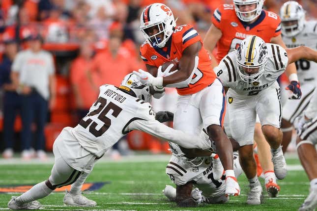 Sep 9, 2023; Syracuse, New York, USA; Syracuse Orange running back Juwaun Price (28) runs with the ball as Western Michigan Broncos cornerback Aaron Wofford (25) defends during the first half at the JMA Wireless Dome.