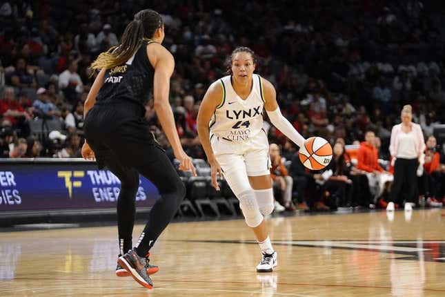 May 28, 2023; Las Vegas, Nevada, USA; Minnesota Lynx forward Napheesa Collier (24) dribbles the ball against Las Vegas Aces center Kiah Stokes (41) during the second quarter at Michelob Ultra Arena.