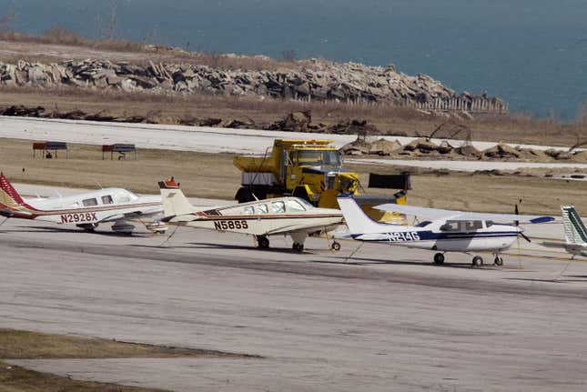 Stranded aircraft with the destroyed runway in the background.