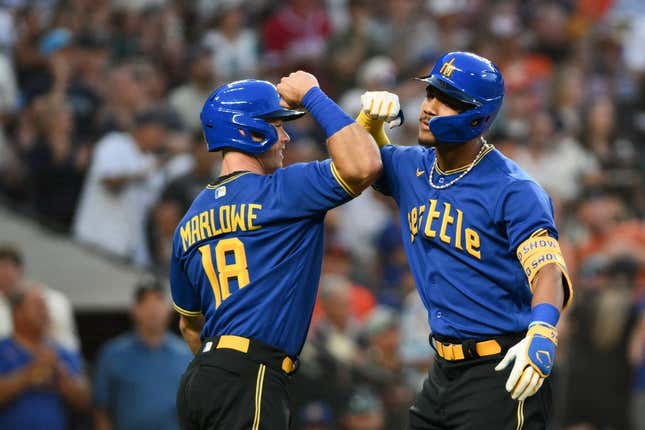 Aug 11, 2023; Seattle, Washington, USA; Seattle Mariners left fielder Cade Marlowe (18) and center fielder Julio Rodriguez (44) celebrate after Rodriguez hit a 3-run home run against the Baltimore Orioles during the fourth inning at T-Mobile Park.