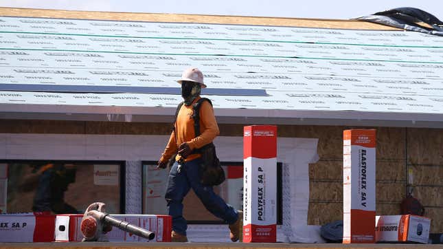 A construction worker continues building at a large housing development, April 21, 2020, in Phoenix.