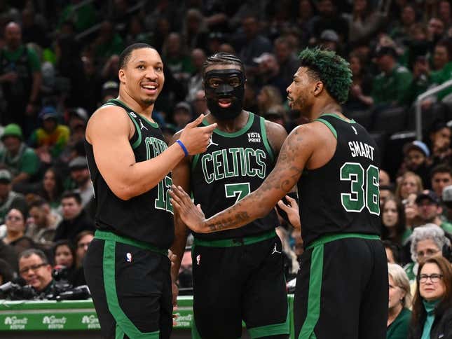 Mar 26, 2023; Boston, Massachusetts, USA; Boston Celtics forward Grant Williams (12), guard Jaylen Brown (7), and guard Marcus Smart (36) talk during a timeout during a game against the San Antonio Spurs at the TD Garden.